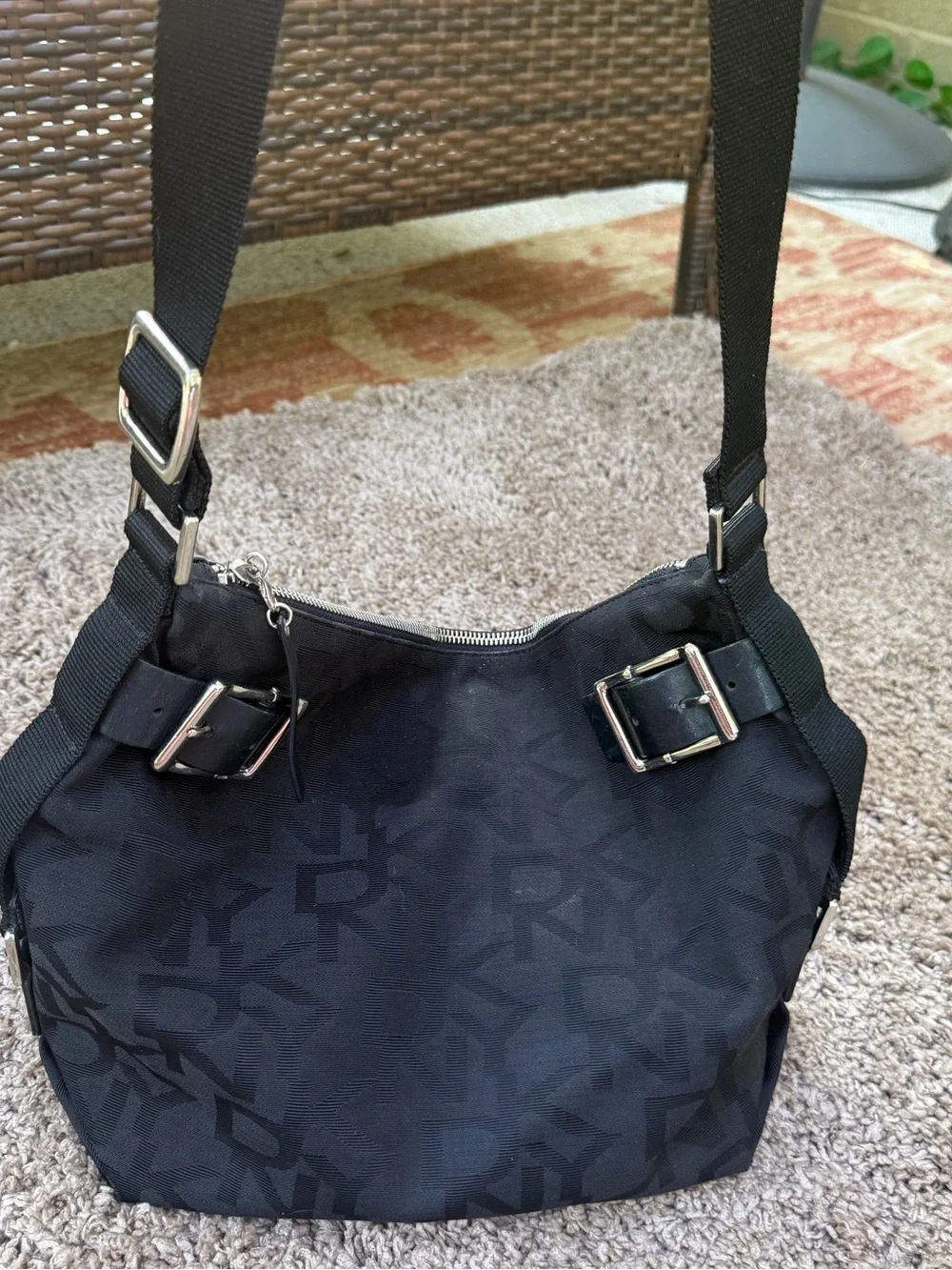 DKNY Black Monogram Messenger Bag with Gold Buckle Accents